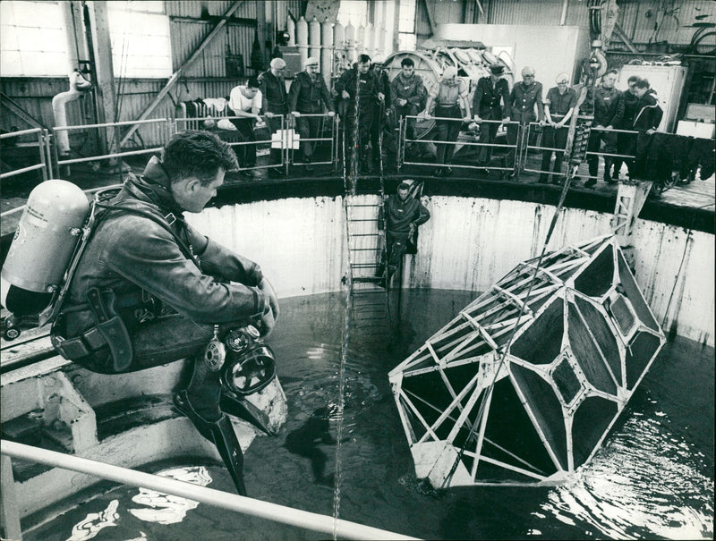 Airmens sea escape:a safety swims in the tank. - Vintage Photograph