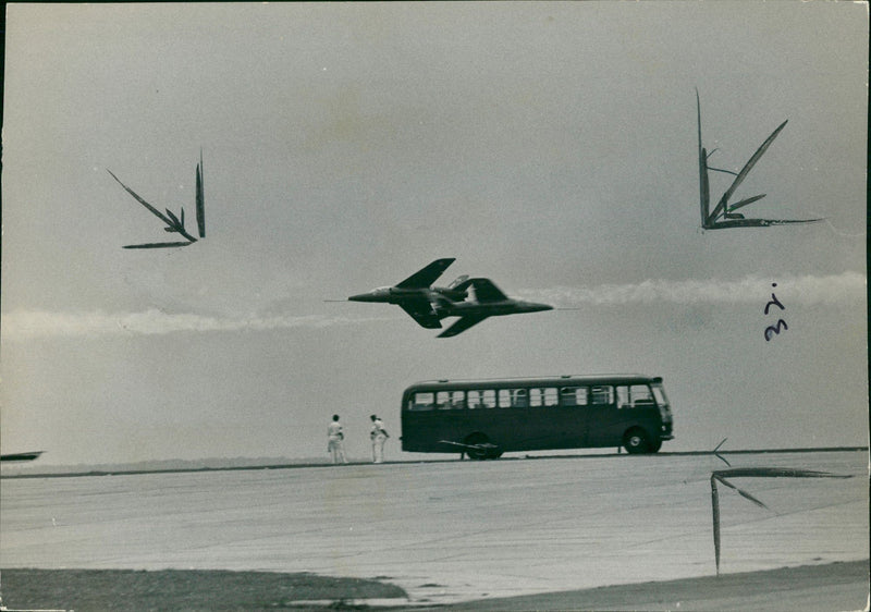 Red arrows aircraft:great advance jet trainers passing. - Vintage Photograph