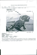 Qantas aircraft:an airplane flies over a uniquely painted. - Vintage Photograph