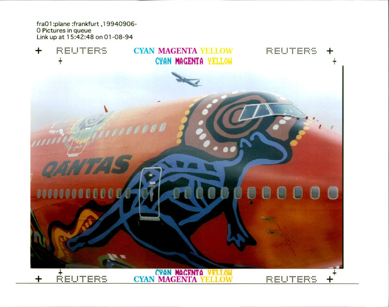 Qantas aircraft:an airplane flies over a uniquely painted. - Vintage Photograph