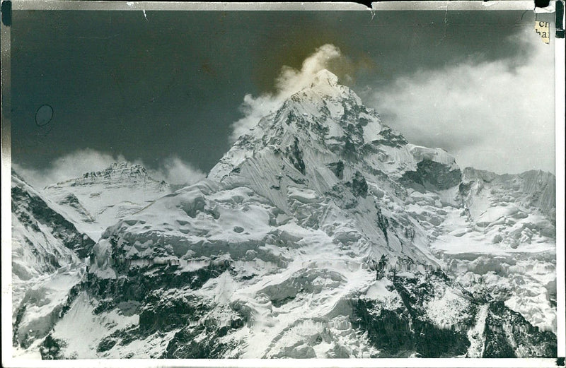 The rugged snow-covered face of Nuptse. - Vintage Photograph