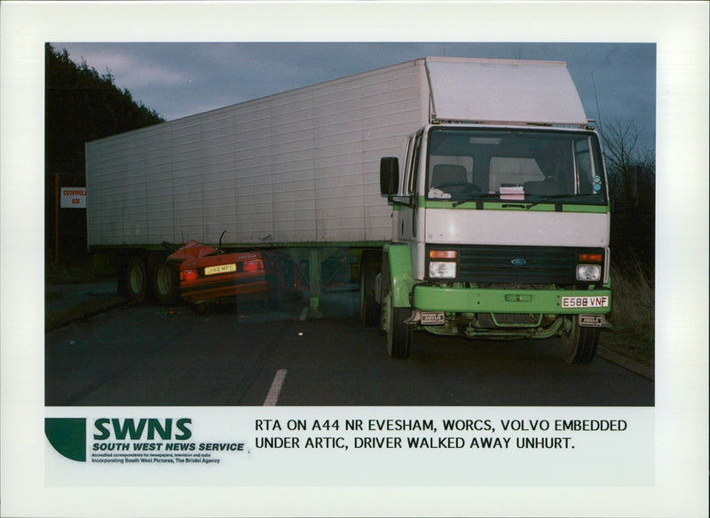 Volvo Embedded under artic, driver walk away. - Vintage Photograph