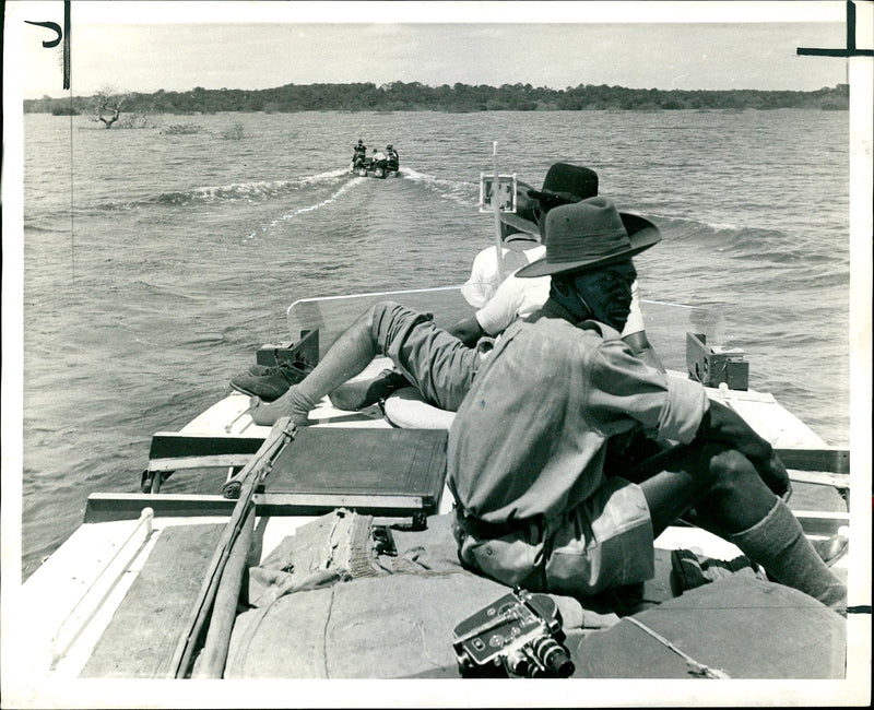 Another small craft carrying some of the rescued animal. - Vintage Photograph