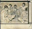 Reading time fro captured iraqi soldiers in an iranian detention centre. - Vintage Photograph