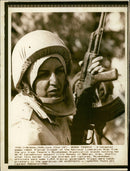 A helmeted woman rebel iranian trooper. - Vintage Photograph