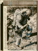 A iranian soldiers being carried away. - Vintage Photograph