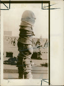 A stack of iranian helmet and other military. - Vintage Photograph