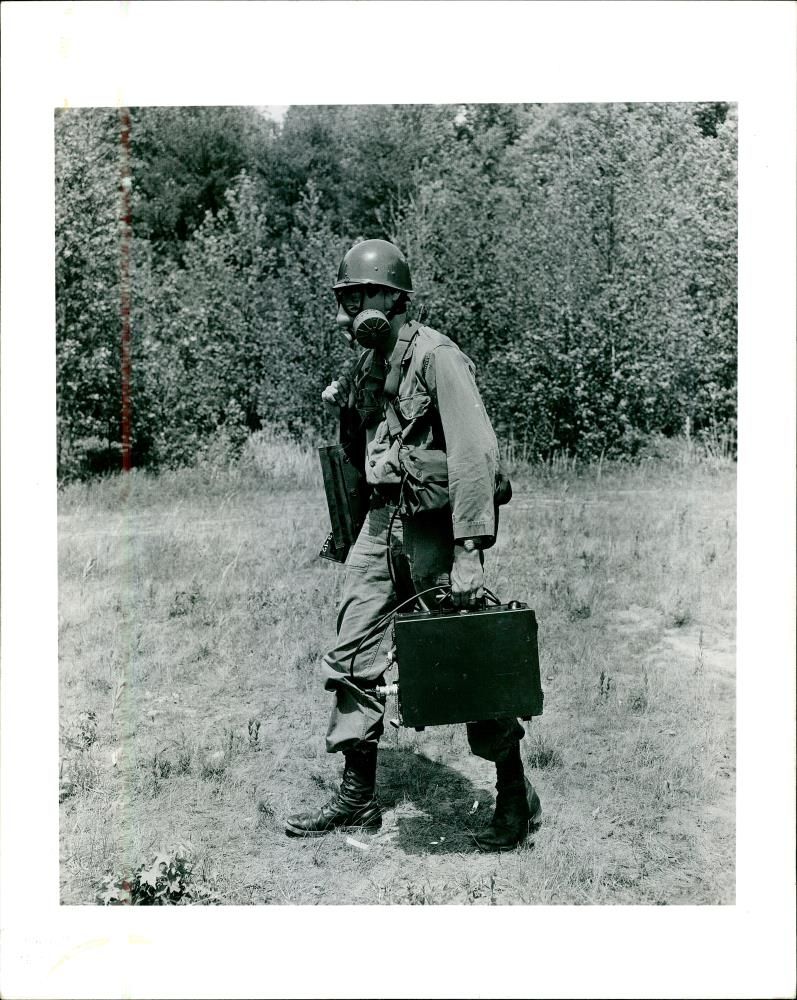 Basic trainees manever through a thick smoke. - Vintage Photograph