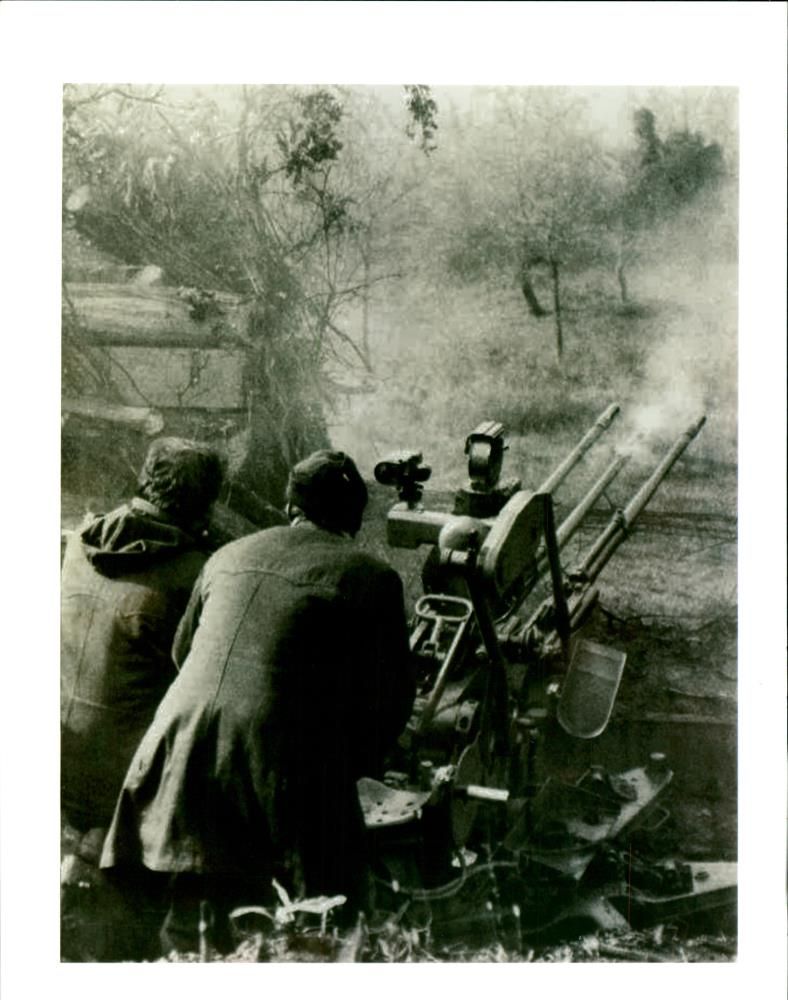 Bosnian Serb soldiers fire an anti aircraft gun. - Vintage Photograph