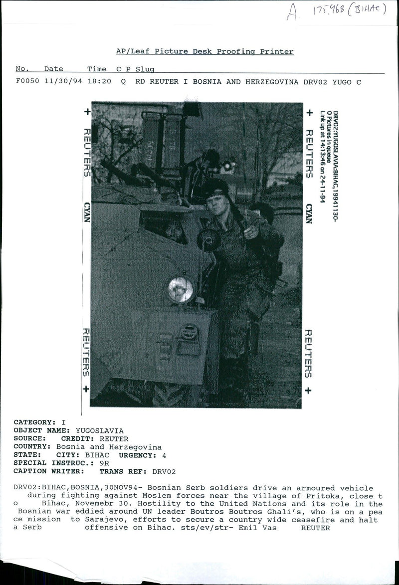 Bosnian Serb soldiers drive an armoured vehicle. - Vintage Photograph