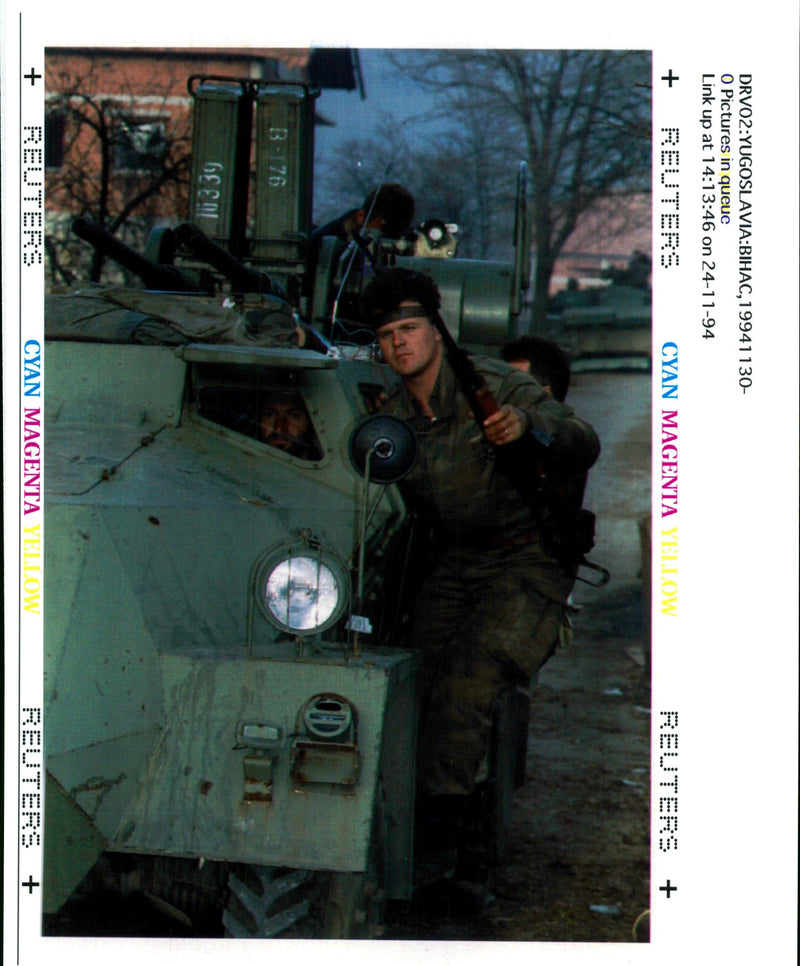 Bosnian Serb soldiers drive an armoured vehicle. - Vintage Photograph