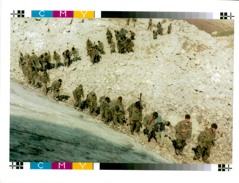 Bosnian army troops walk up a hill near Visoko. - Vintage Photograph