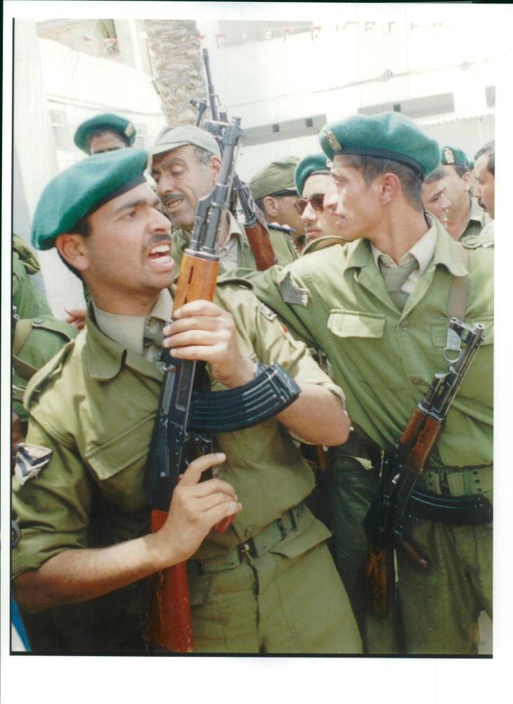 Palestinian Police officers holding their rifles. - Vintage Photograph