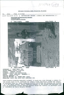 A young man runs through a rubble filled street. - Vintage Photograph