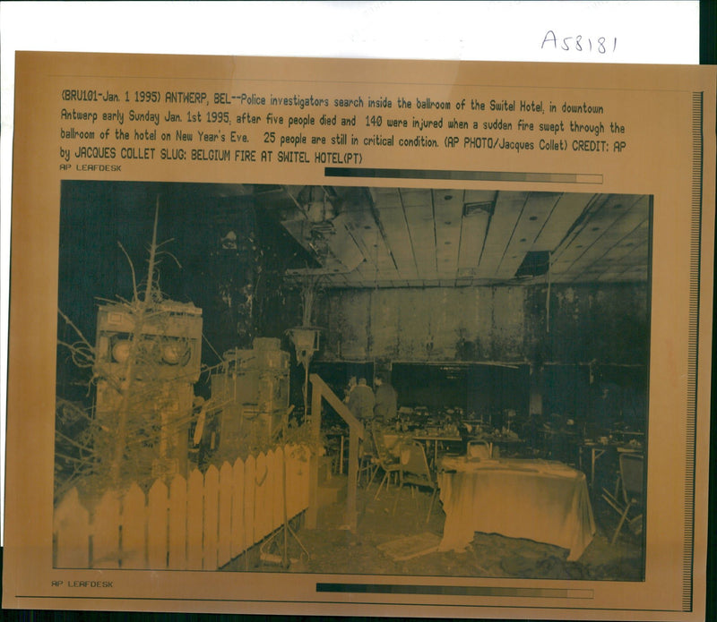 Police Investigators search inside the ballroom of the Switel Hotel. - Vintage Photograph