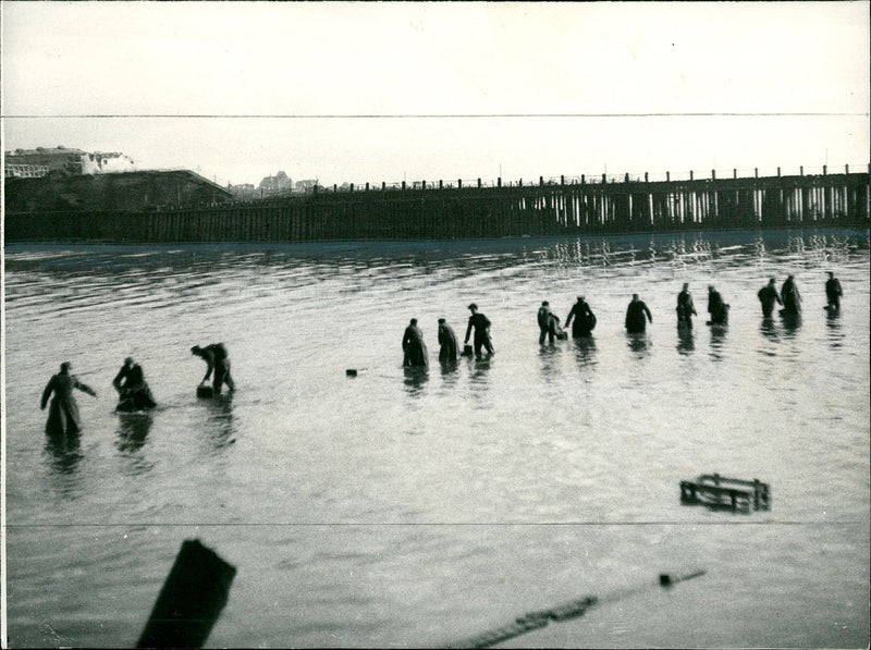 First assault troops landing on flushing. - Vintage Photograph
