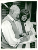Janette Adams, Kim Newell's sister collects pro hanging signature from Mr Arthur Reed, Oct 1968. - Vintage Photograph