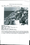 A pakistani soldier takes in a cooling breeze. - Vintage Photograph