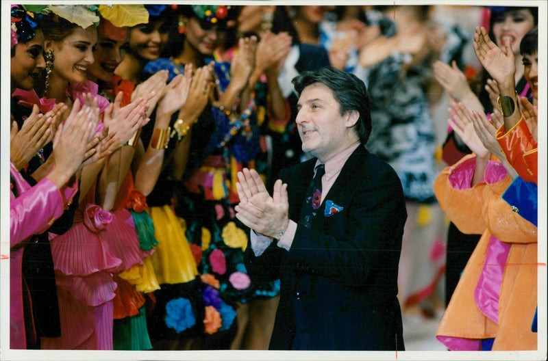 Emanuel Ungaro applauds his models. - Vintage Photograph