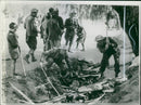 Shows men destroying equipment of the enemy. - Vintage Photograph