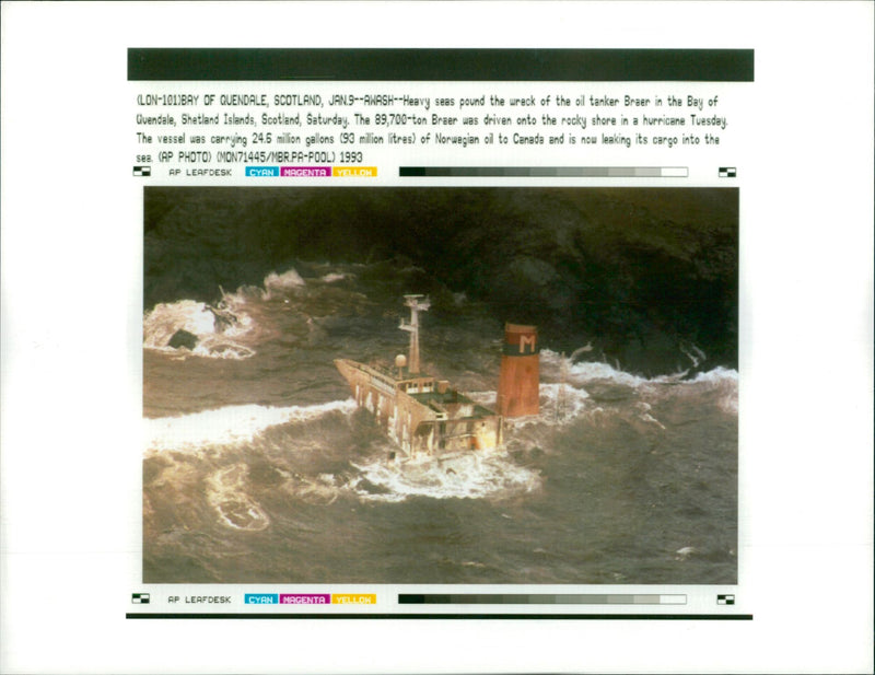 Geavy seas pound the wreck of the oil tanker. - Vintage Photograph