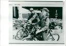 Two soldier biking on the street. - Vintage Photograph