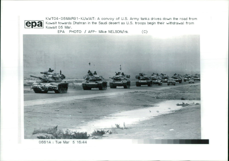 A convoy of U.S. Army tanks drivers down the road from Kuwait towards Dhahran. - Vintage Photograph