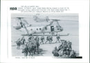 United States Marines prepare to board CH-46. - Vintage Photograph