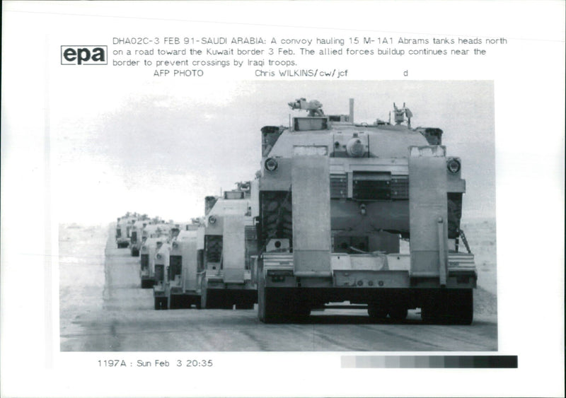 A convoy hauling 15 M-1A Abrams tanks. - Vintage Photograph