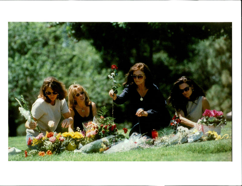 Nicole Brown Simpson's sister and mother place flowers on the murder victim's. - Vintage Photograph