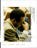 Defendant O.J Simpson rubs his eyes during the late afternoon court session in his murder trial. - Vintage Photograph