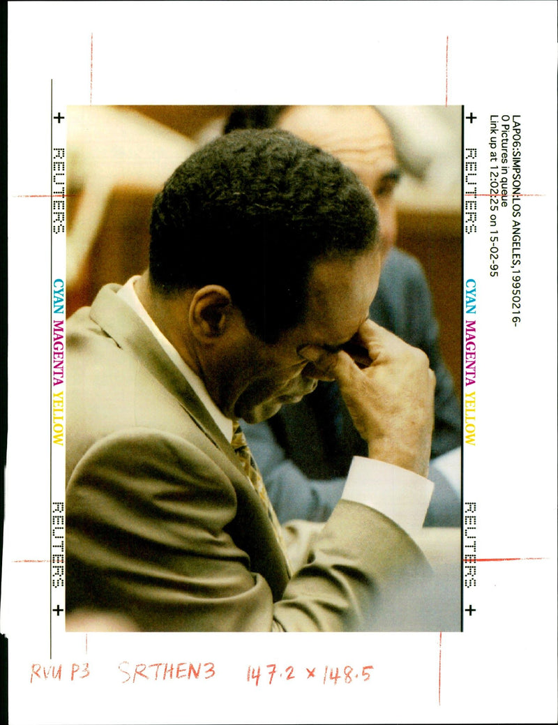 Defendant O.J Simpson rubs his eyes during the late afternoon court session in his murder trial. - Vintage Photograph