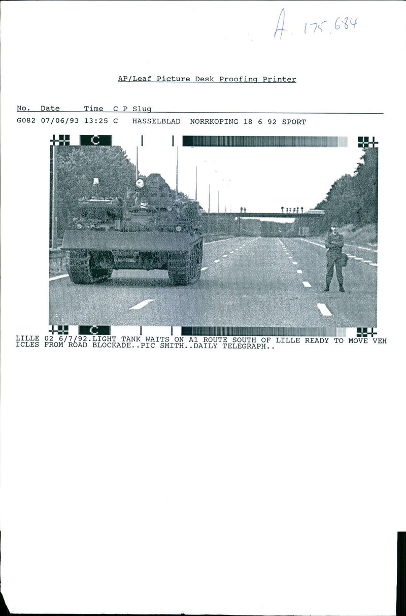 Light tank waits on A1 Route South of Lille. - Vintage Photograph