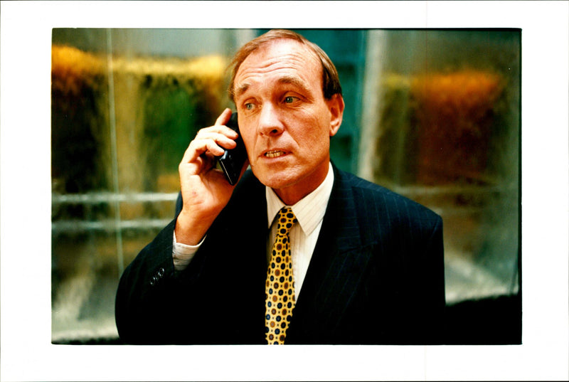 Richard Goswell Managing Director of Mercury One-2-One, on office balcony at cable and wireless HQ. - Vintage Photograph