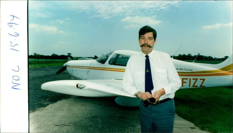 Nigel Wright near a plane. - Vintage Photograph