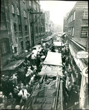 Even the Rain Did Not Deter Shippers hunting for Bargains. - Vintage Photograph