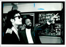 A photo showing a man named Berry Gordy with Michael Jackson. - Vintage Photograph