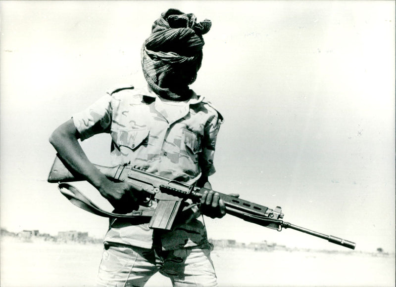 Central government soldier masked and armed. - Vintage Photograph