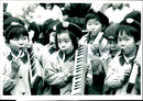 Primary School Age Children Playing Their Wind Assited Musical Instruments. - Vintage Photograph