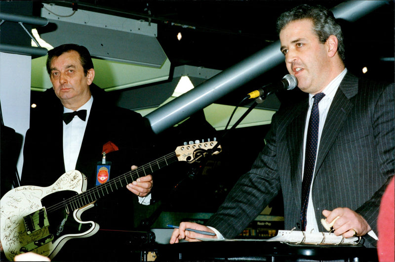 Signature tune: the Federer Telecaster, bearing the autographs of 21 famous rock-stars, goes under the hammer. - Vintage Photograph