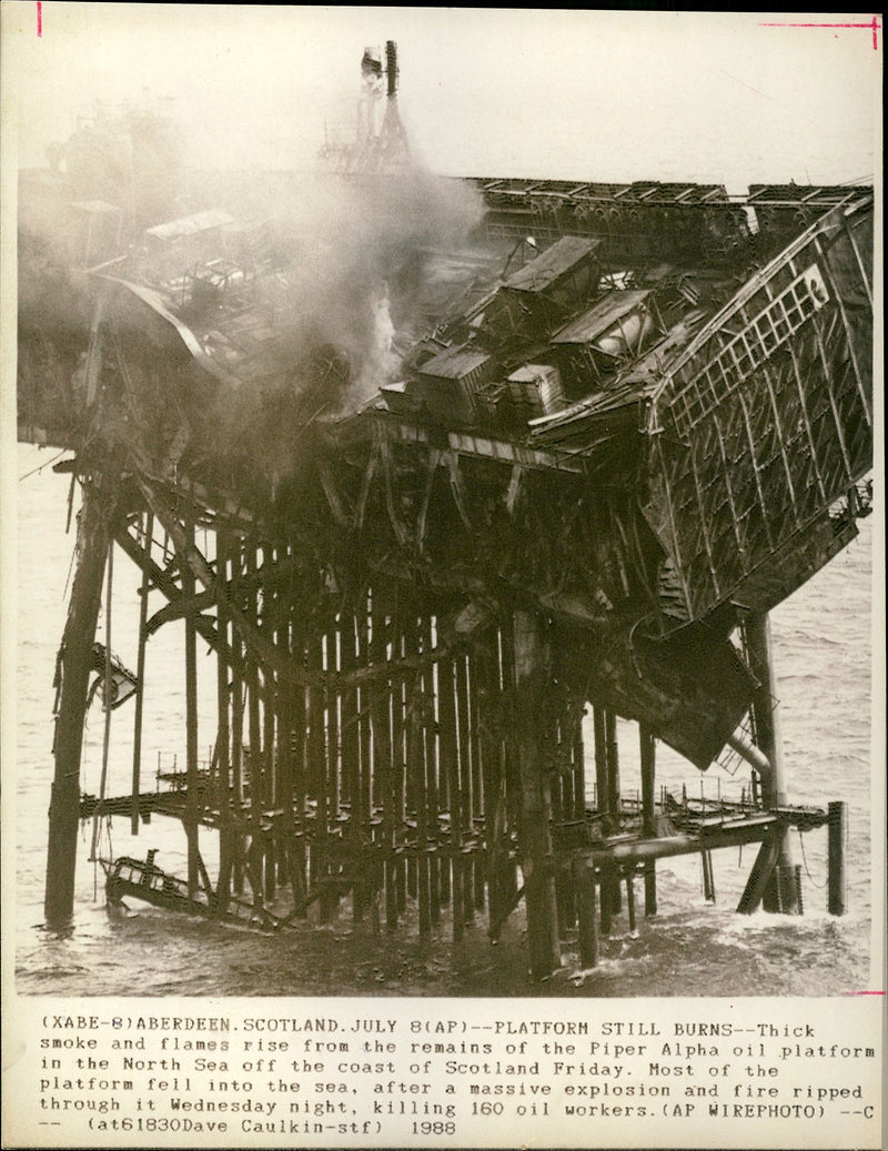 Smoke still rising from the remains of the Piper Alpha oil rigs after blast - Vintage Photograph