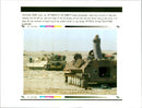 A Kuwaiti photographer stands atop a burned out Iraqi tank. - Vintage Photograph