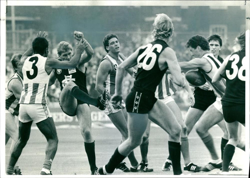 Mark Maclure evades Jim Krakouer - Vintage Photograph