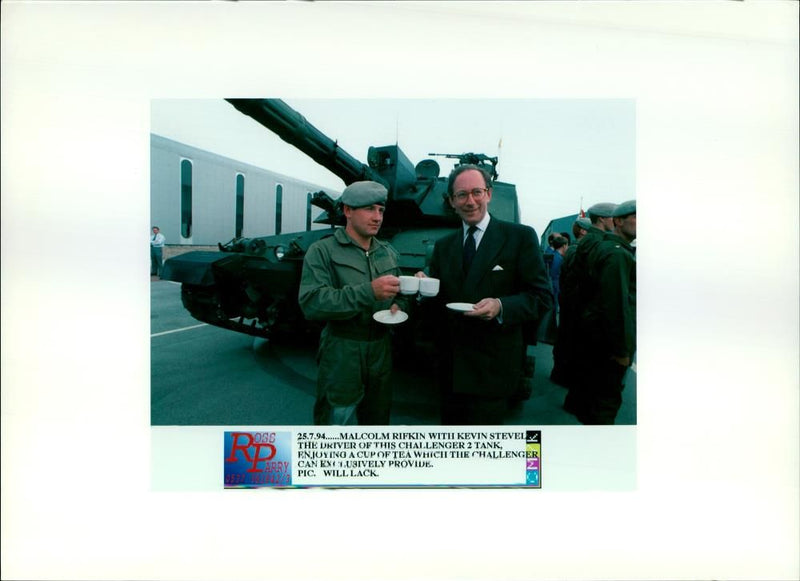 Poses with British battle tank 'Challenger 2' designed by Vickers - Vintage Photograph