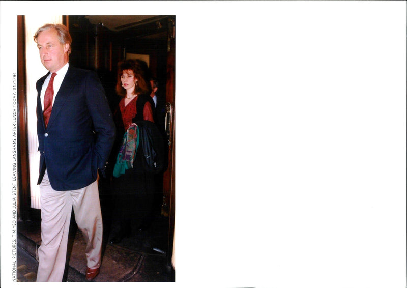 1994 TIM YEO AND JULIA STENT ARE PICTURED LEAVING LANGHAMS AFTER LUNCH TODAY - Vintage Photograph