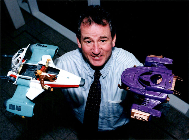 CHRIS BURGIN CHIEF EXECUTIVE BLUEBIRD TOYS PLC WITH THE NEW SPACE MONKEYS - Vintage Photograph