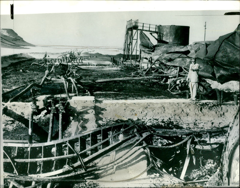 Twisted steel piping and burned out tanks - Vintage Photograph