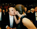 Nobel Laureate Louis J. Ignarro kisses his wife at the 1998 Nobel Prize in the Concert Hall. - Vintage Photograph