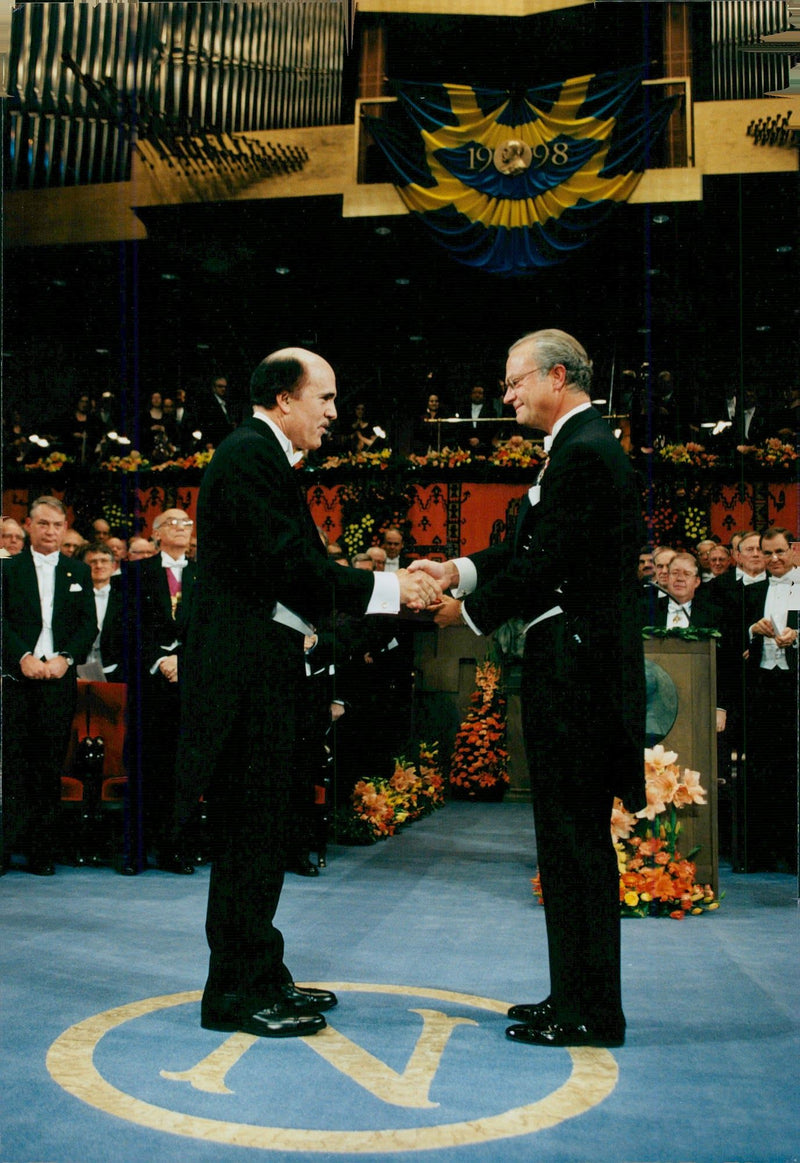 Nobel Laureate Louis J. Ignarro receives his prize from King Carl Gustaf at the 1998 Concert Hall. - Vintage Photograph