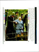 Russian Riot Police Officer  helps an old Moscow Woman - Vintage Photograph